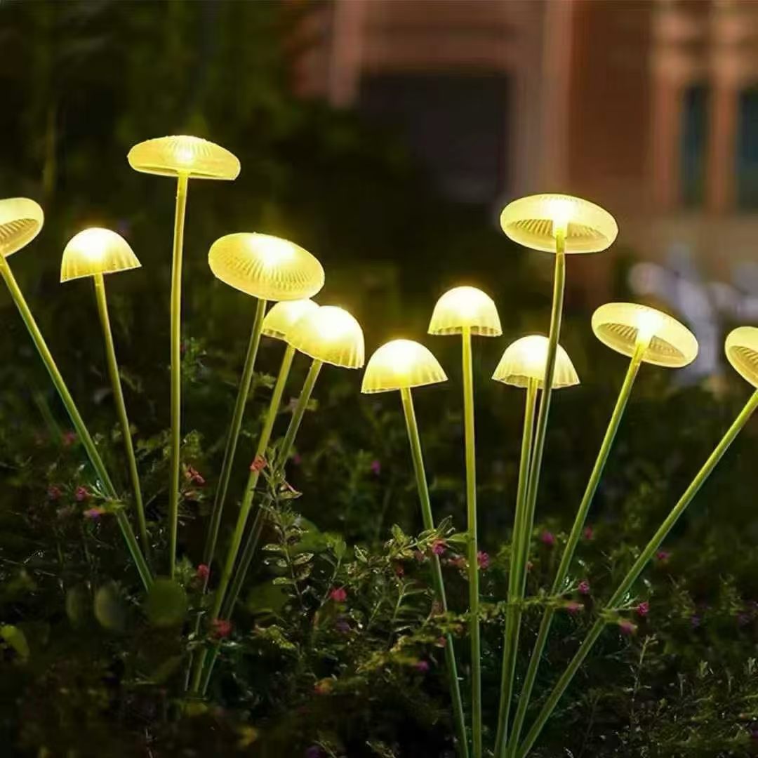 Small illuminated mushroom lights in a garden