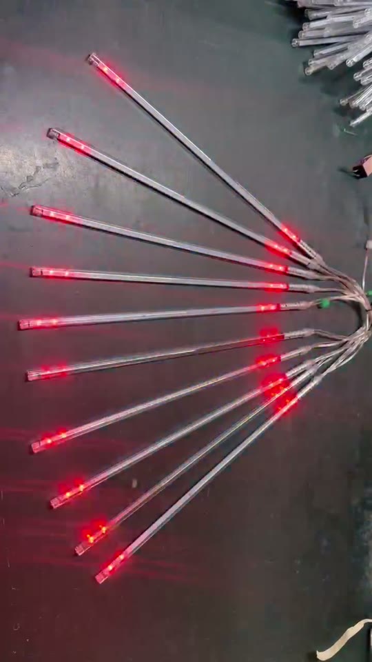 Red meteor lights arranged in a fan shape